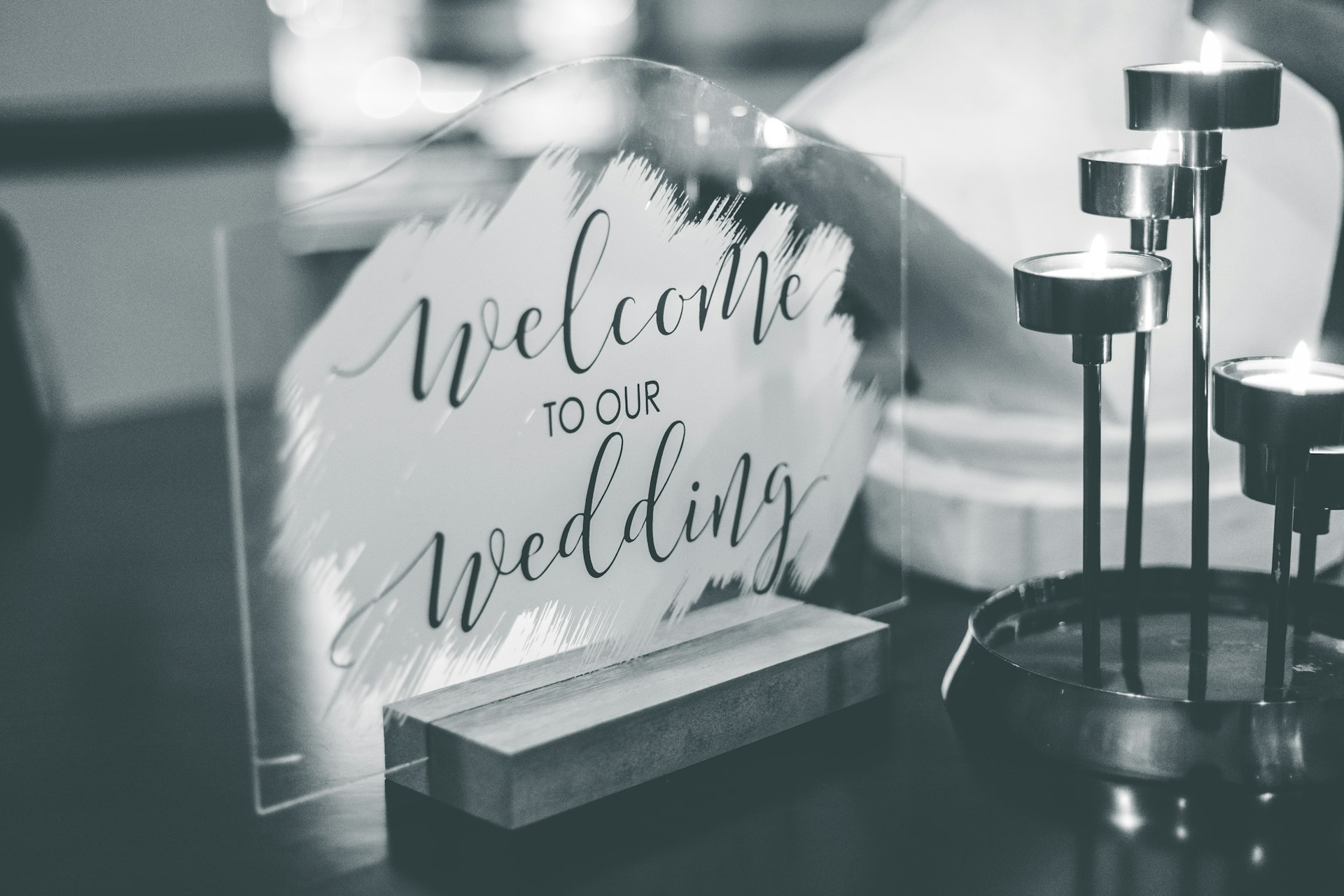 a black and white photo of a welcome sign